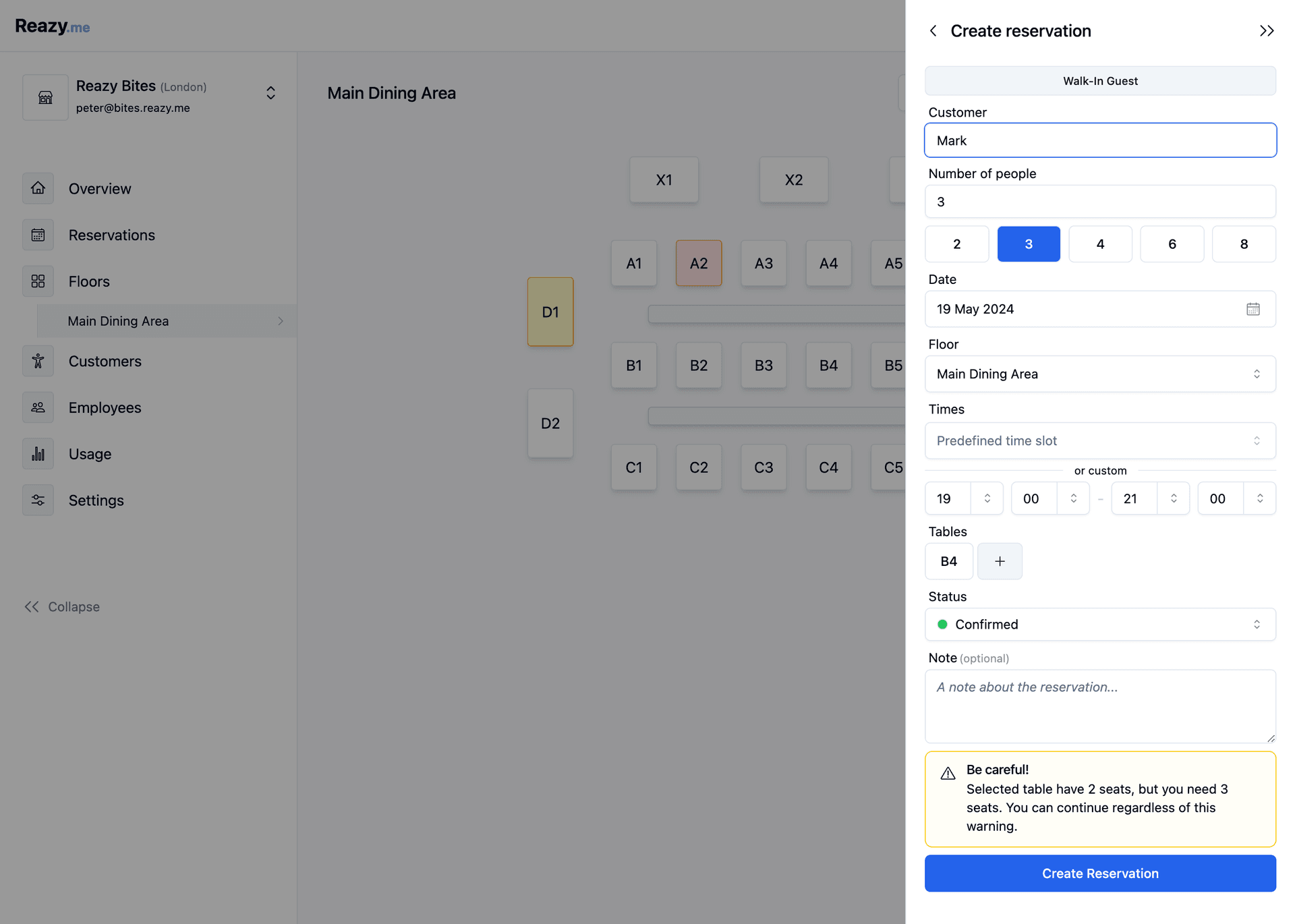 Screenshot of the Reazy.me interface showing the process of creating a reservation at Reazy Bites in London. The 'Create reservation' drawer is open and in focus on the right, with fields to enter customer name ('Mark'), number of people (3), date (19 May 2024), floor (Main Dining Area), time (19:00), table (B4), and reservation status (Confirmed). A warning message states that the selected table has 2 seats but 3 are needed. The main dining area layout is partially visible in the background.